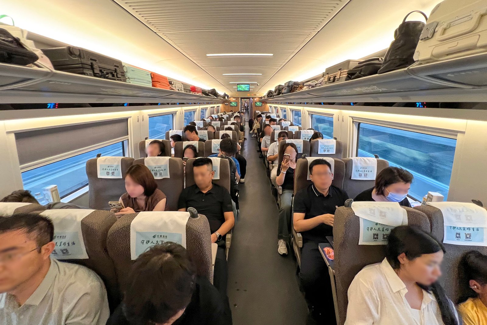 The second-class carriage interior of a CR400BF Fuxing high-speed train on the Beijing South to Shanghai Hongqiao route