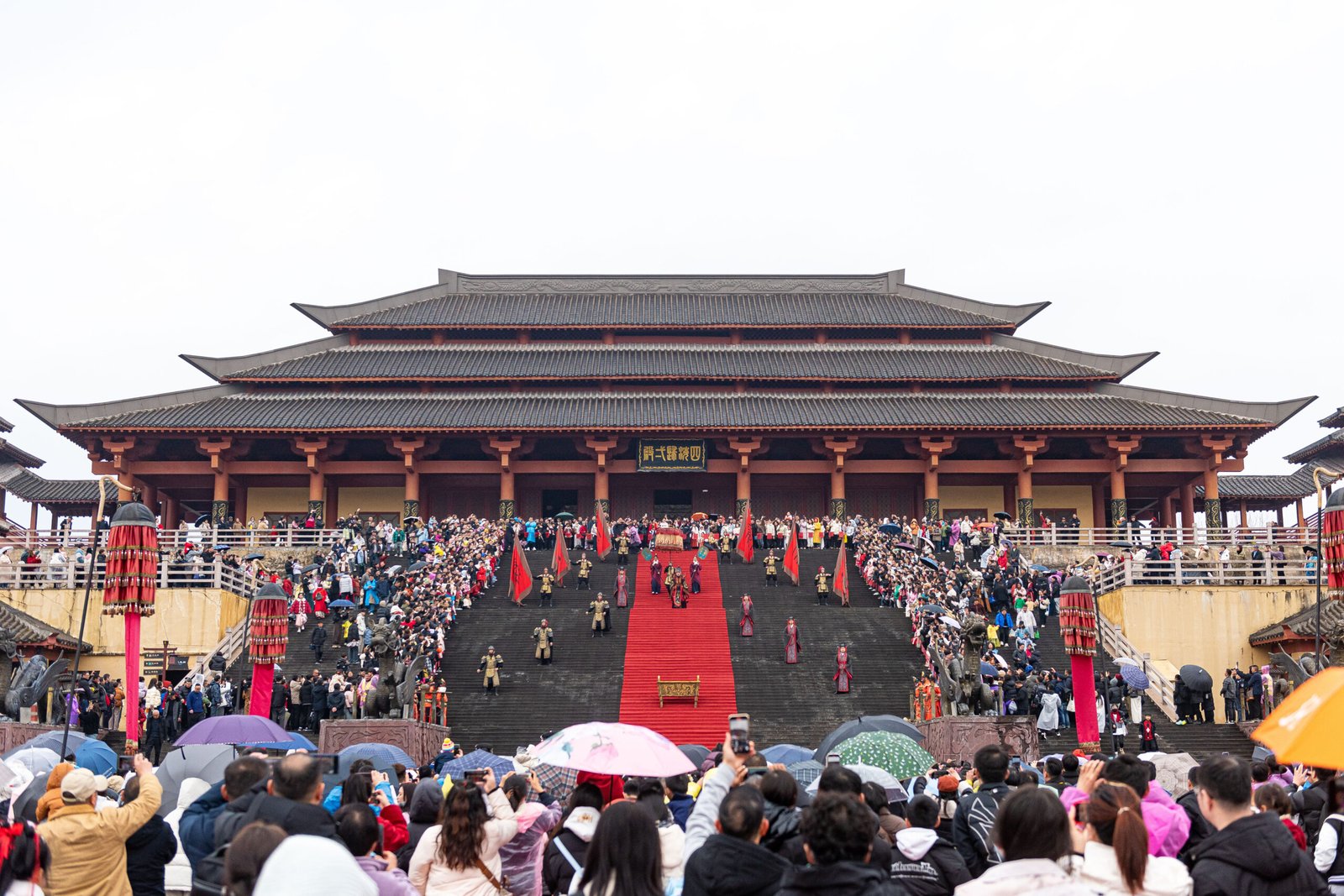 An enthronement ceremony performance on the great staircase of the Unification Hall, Palace of Emperor Qin, Hengdian