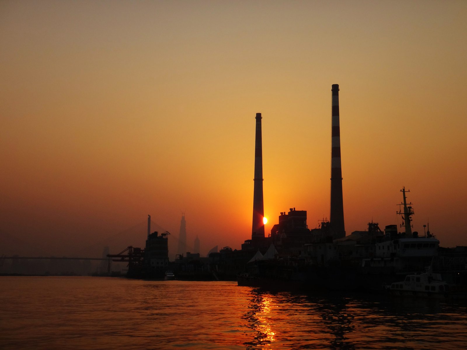 The Yangshupu Power Plant on the Huangpu River in Yangpu District, Shanghai, silhouetted at sunset