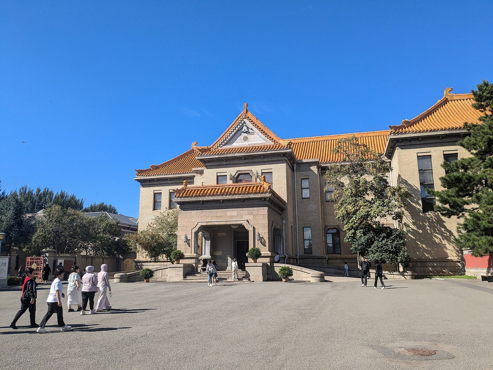 The Tongde Hall of the Puppet Emperor's Palace, a grand building with yellow glazed roof tiles
