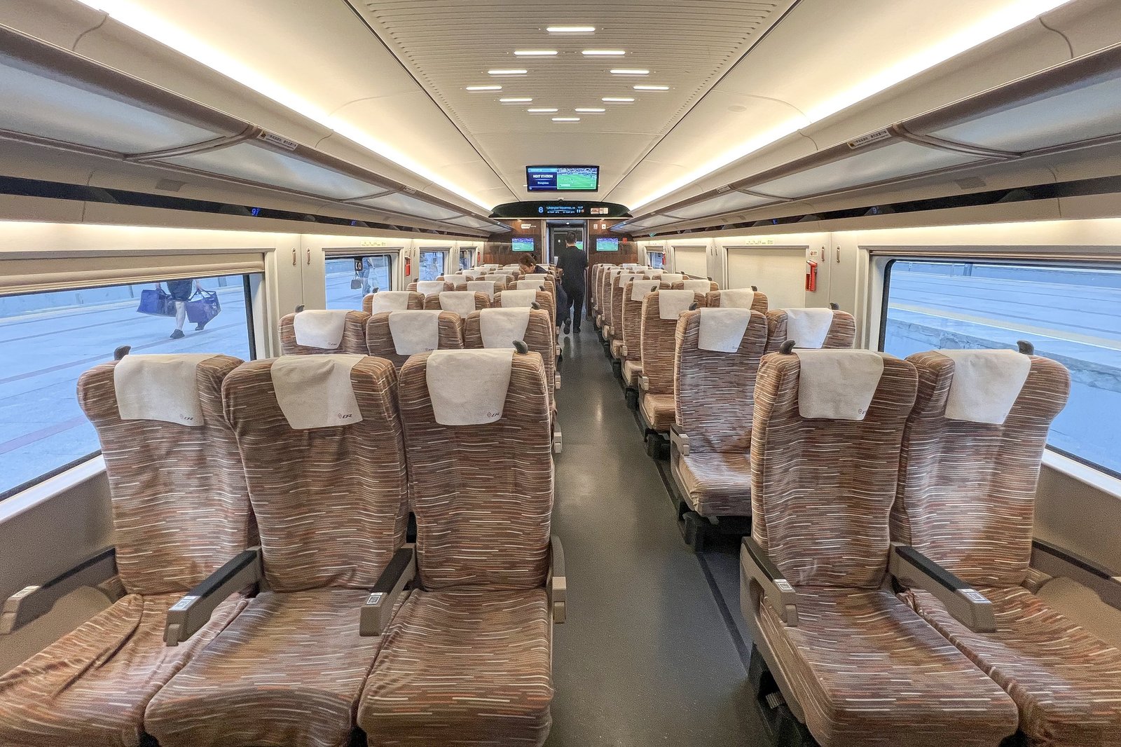 Second-class carriage interior of a China Railway CR400BF Fuxing high-speed train, with rows of reclining seats