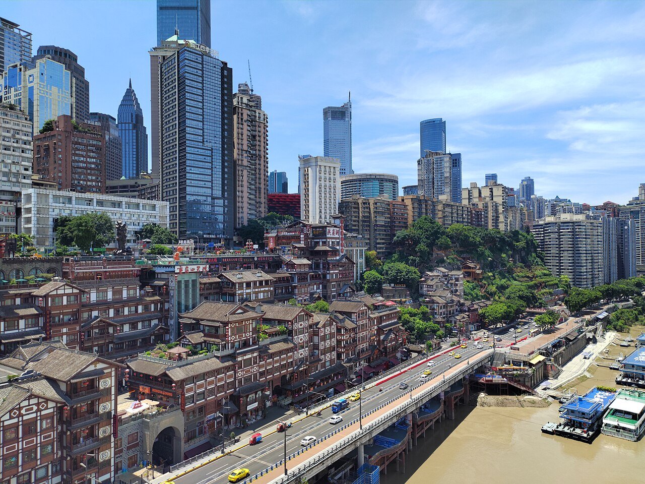 The Chongqing CBD skyscrapers rising behind the traditional buildings of Hongya Cave, above the Jialing River