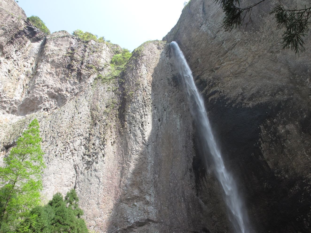 Looking up at the Dalongqiu waterfall at Yandang Mountain, a single-drop cataract falling between cliff walls