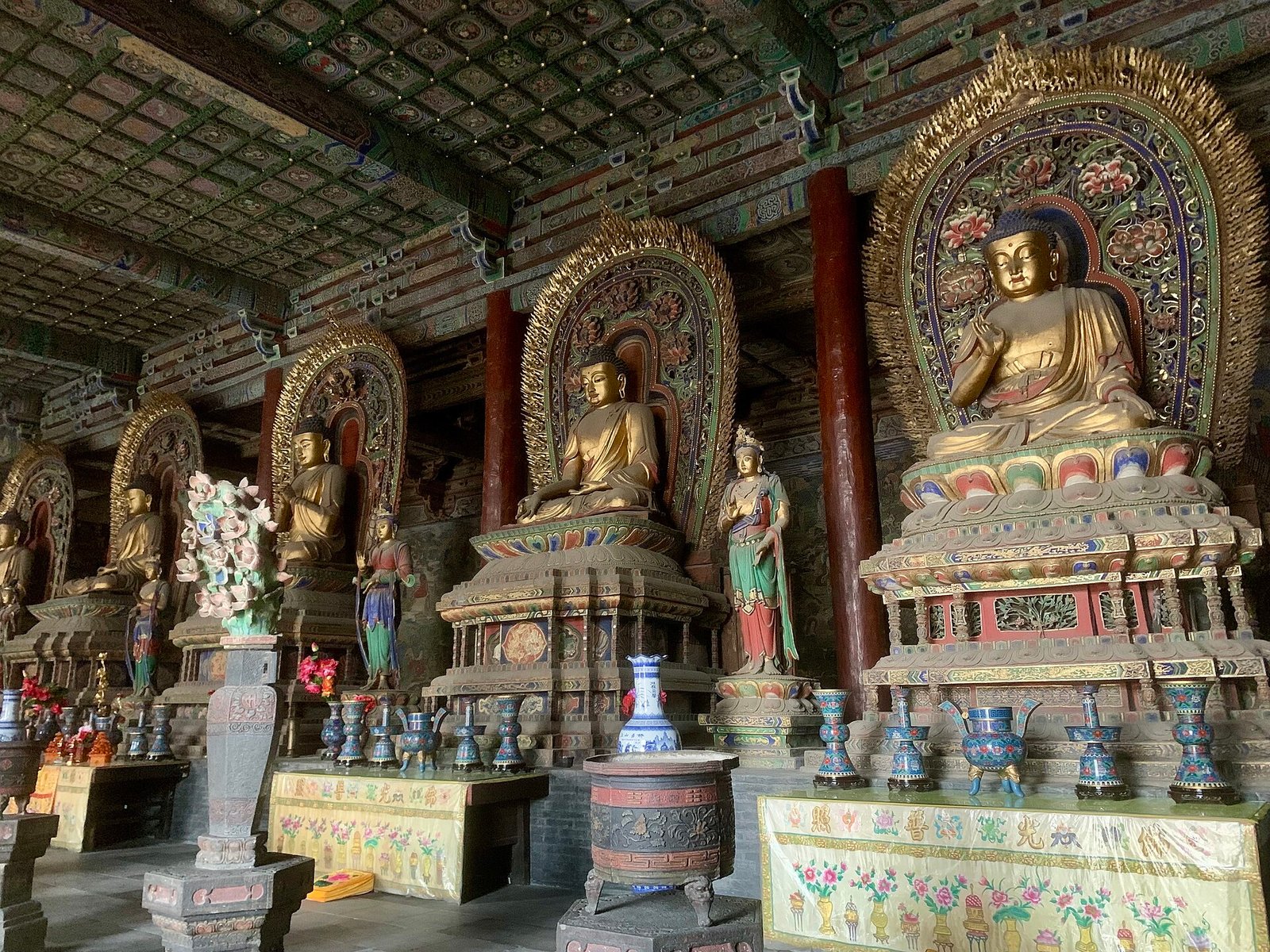 The gilded Buddhist statues inside the main hall of the Huayan Temple in Datong
