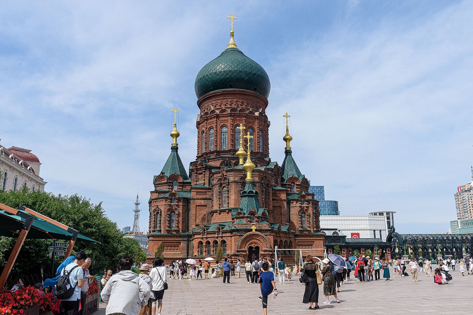 The Saint Sophia Cathedral in Harbin, a red-brick Byzantine church with green onion domes