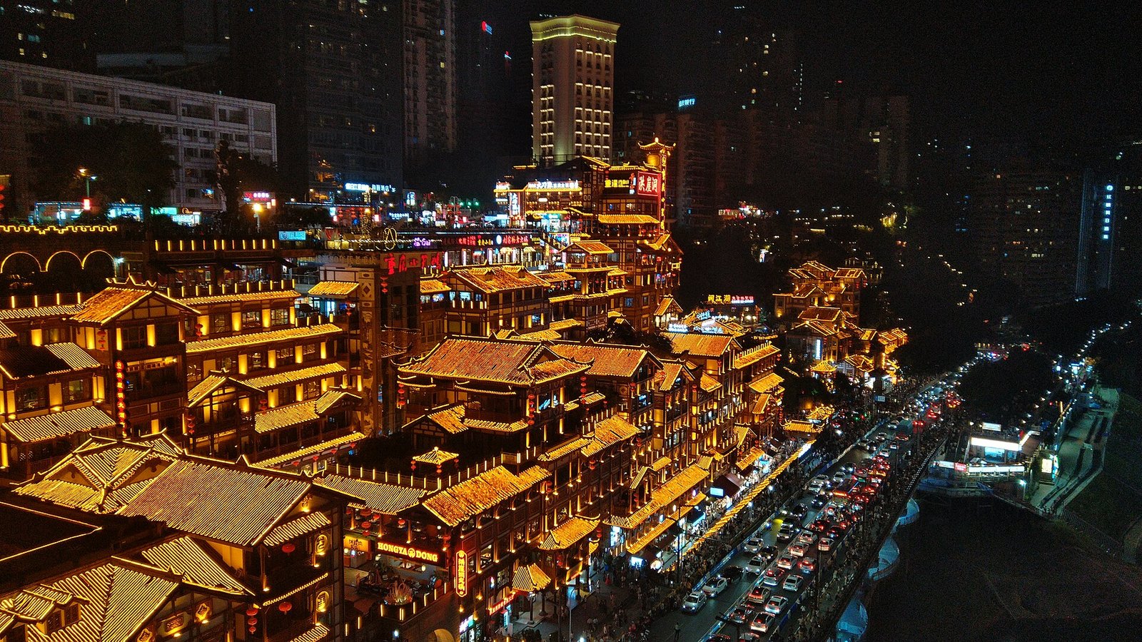 Hongya Cave in Chongqing at night, seen from the Qiansimen Bridge across the Jialing River