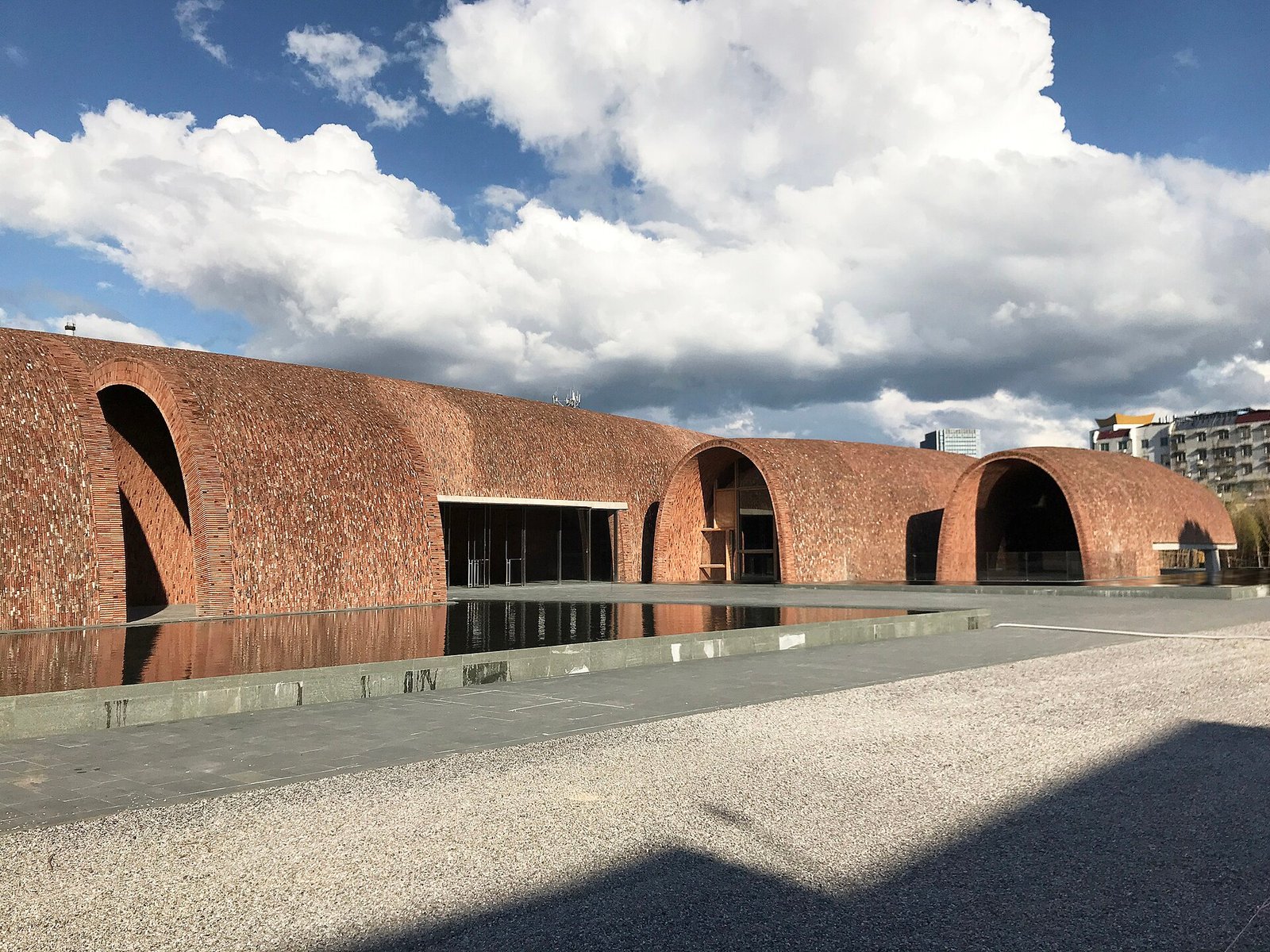 The brick vaults of the Jingdezhen Imperial Kiln Museum, with arched openings facing a paved courtyard