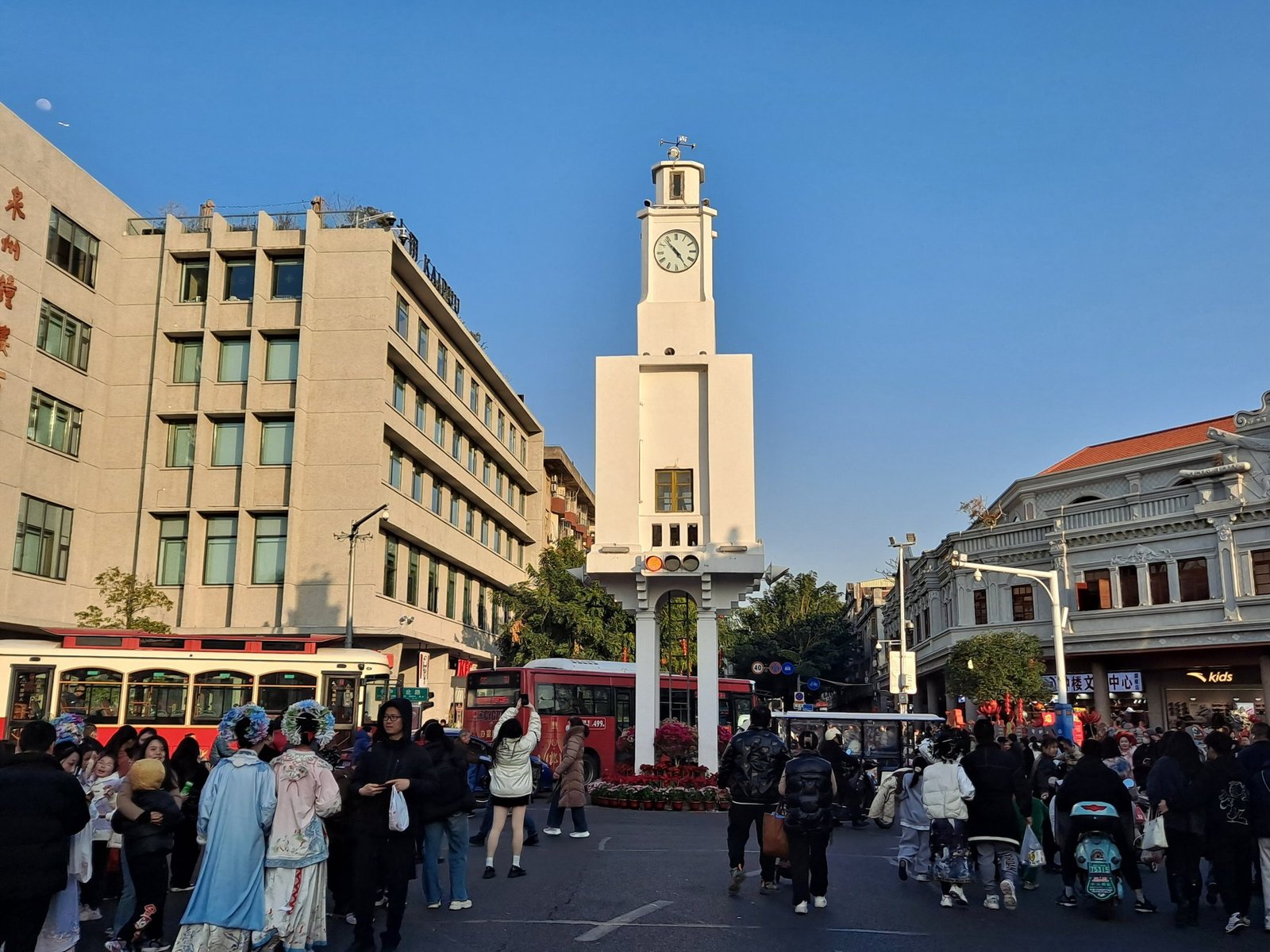 The white Quanzhou Clock Tower standing at a crossroads in the old city