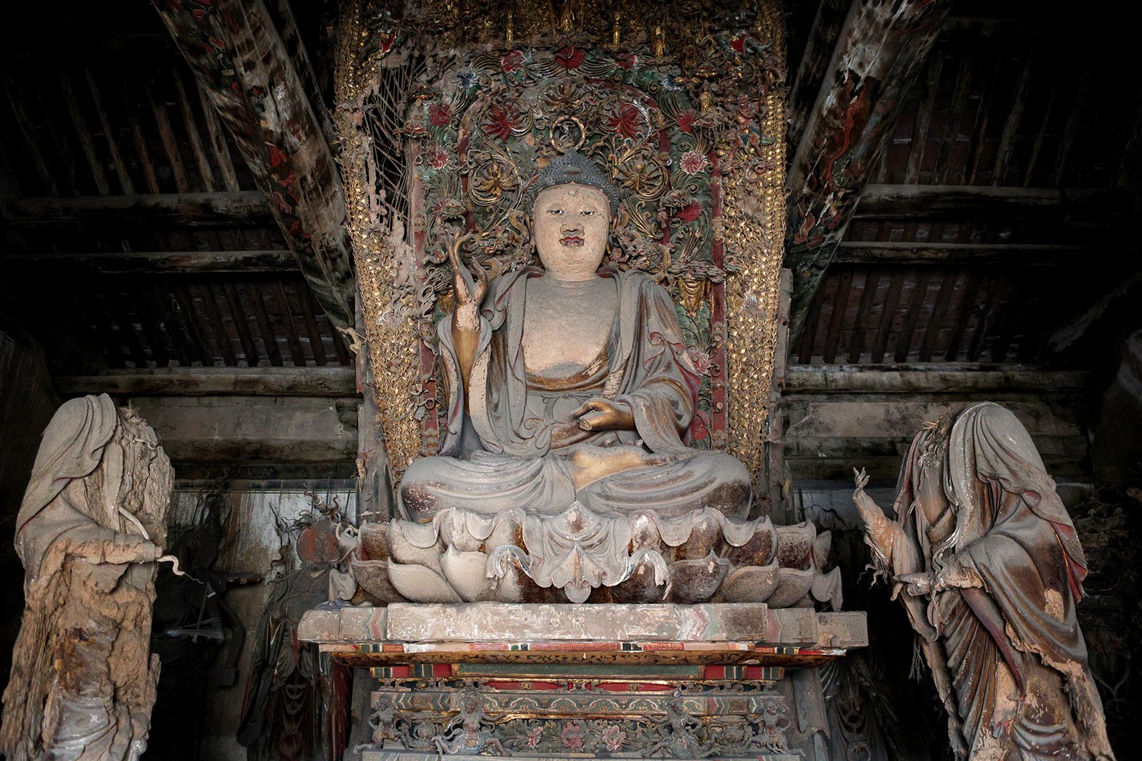 Buddha and painted clay figures inside Tiefo Temple