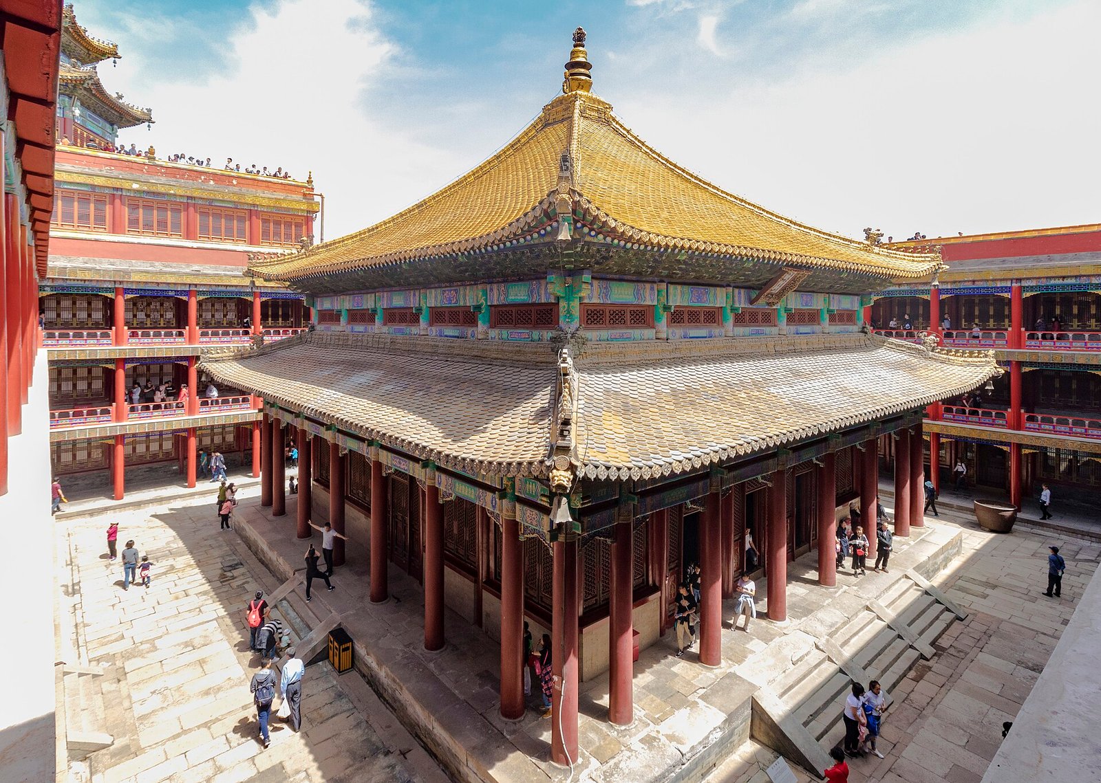 The golden roof and red galleries of the Wanfa Guiyi Hall inside the red terrace at Putuo Zongcheng