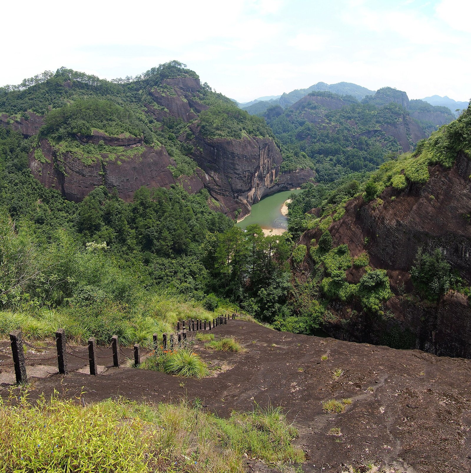 Tianyou Peak at Wuyishan seen from across the stream, with terraced ground in the foreground