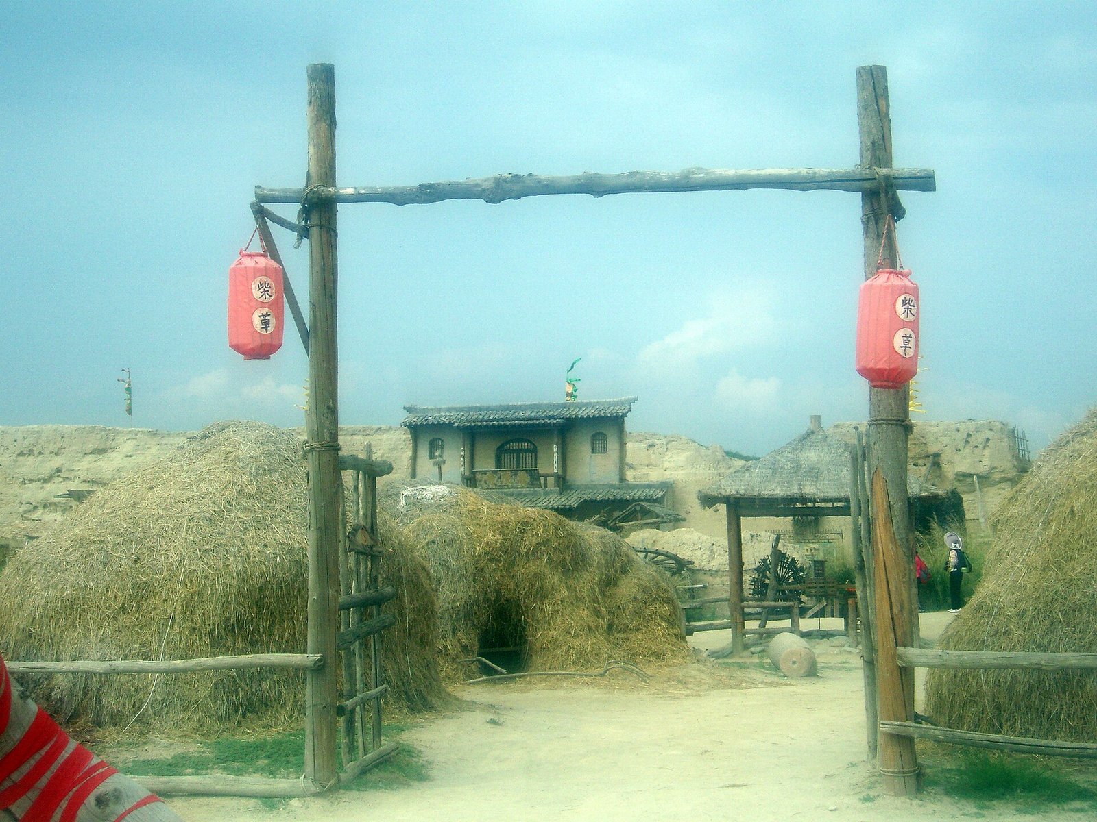 A studio street inside the Zhenbeibao West Film Studio, with timber gates and red lanterns